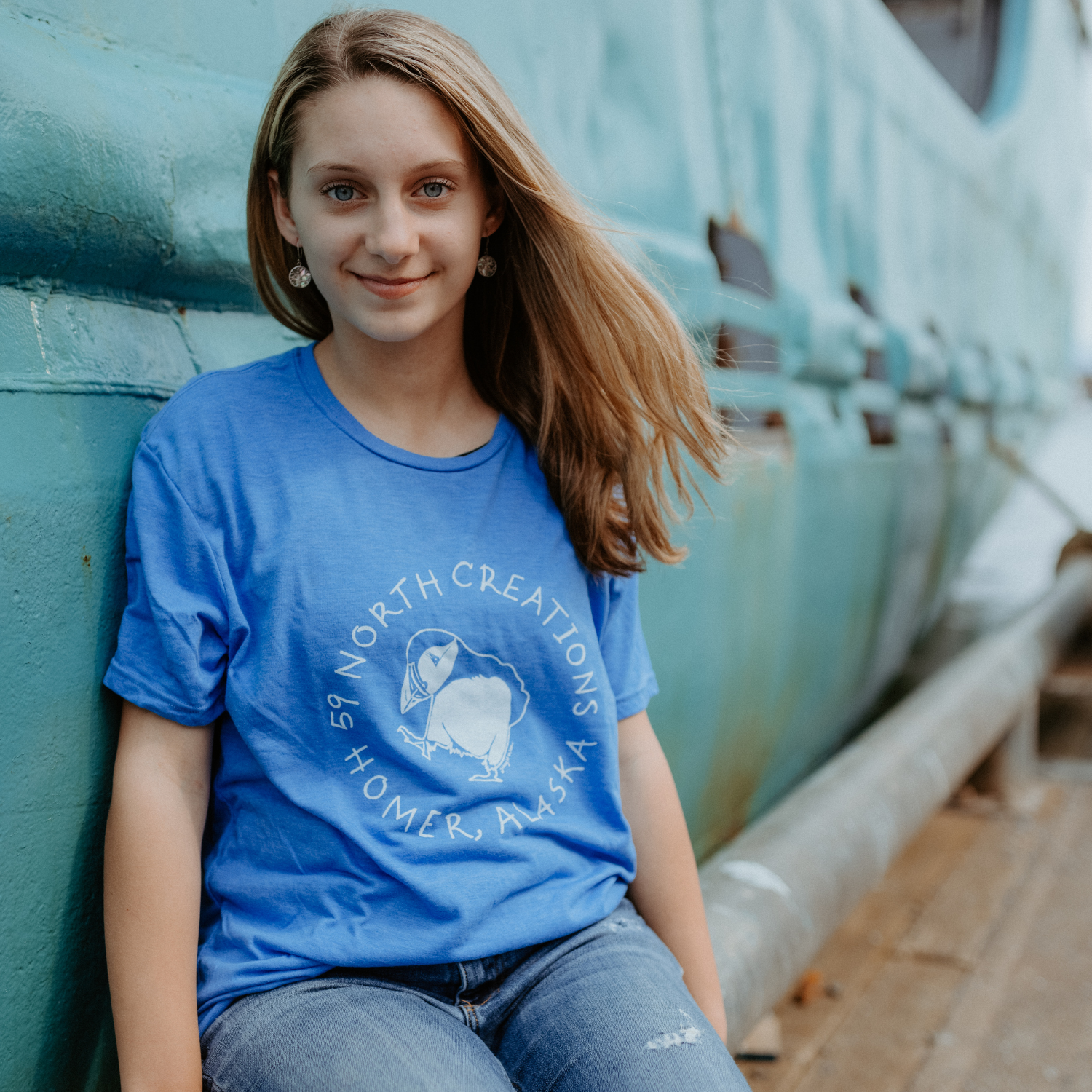 Blue Puffin 59 North Creations, Homer Alaska t-shirt, unisex sizes, this is a small on our female model. 